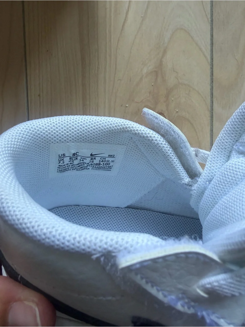 Nike Kids White High-Top Sneakers with Black Swoosh Accent